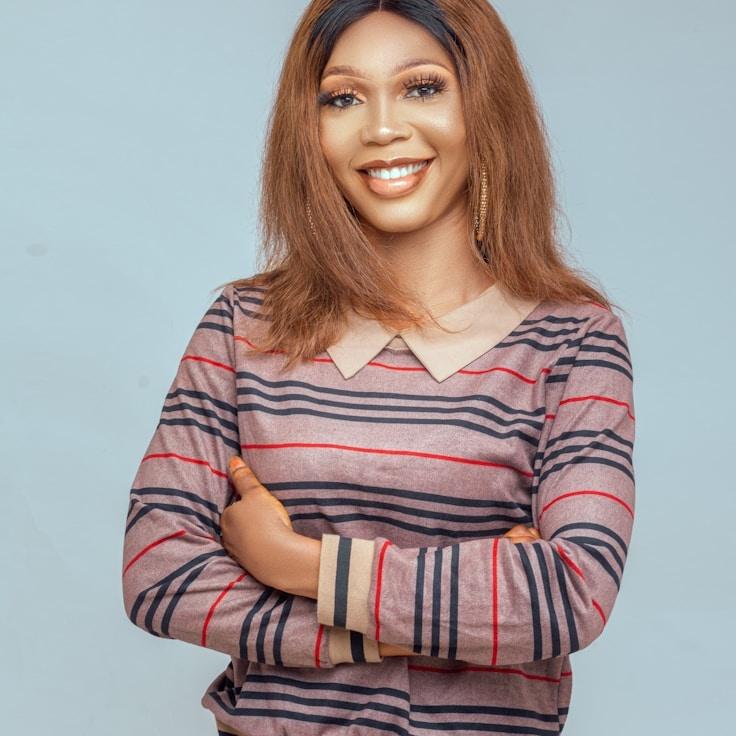 Samantha Reed, Lead Design Curator at Universal Process Hub, reviewing corporate floral arrangements